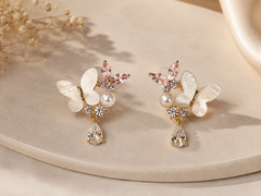 Delicate gold floral earrings with gemstones