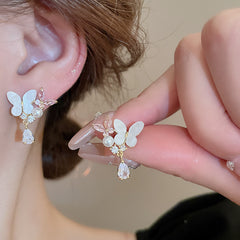 Delicate gold floral earrings with gemstones