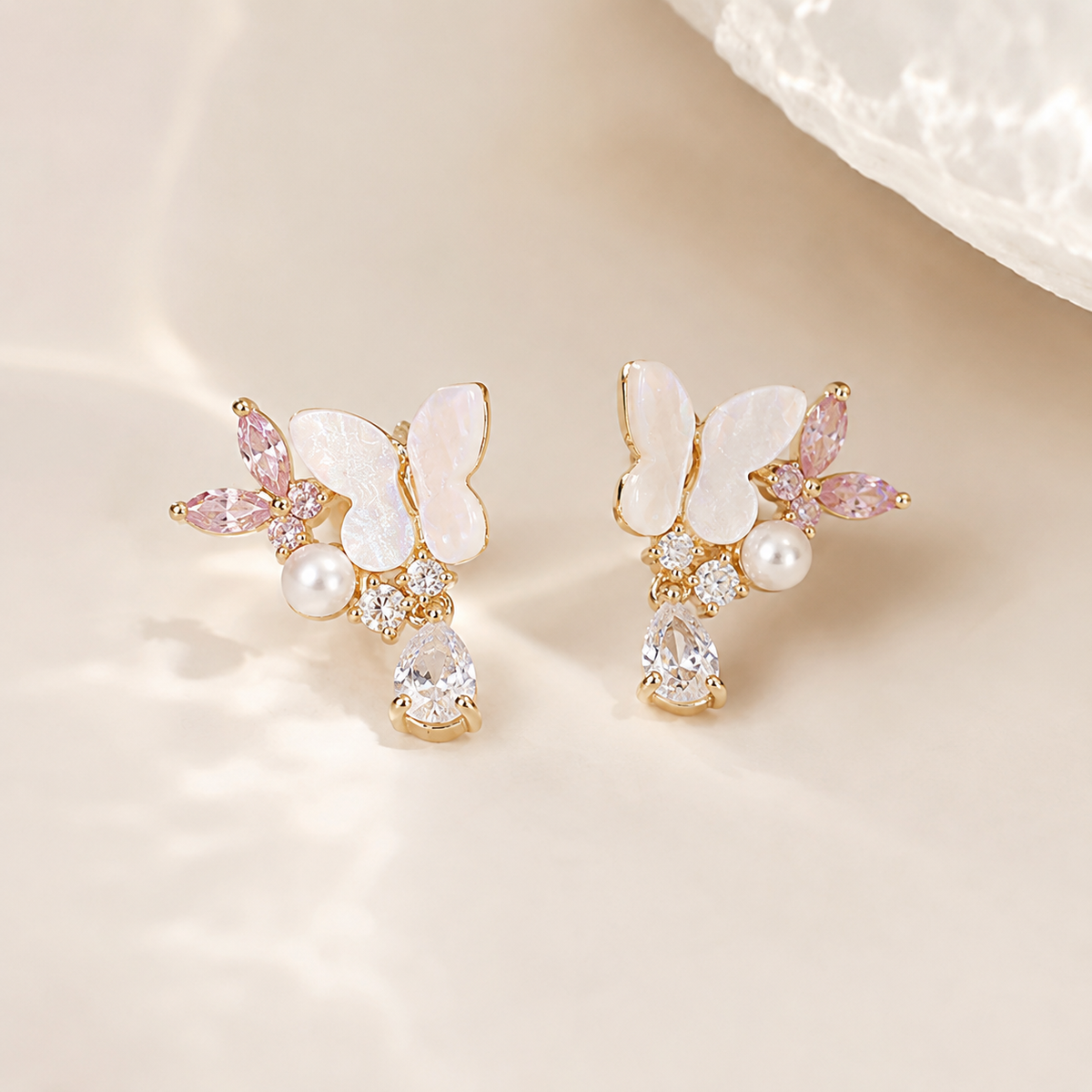 Delicate gold floral earrings with gemstones